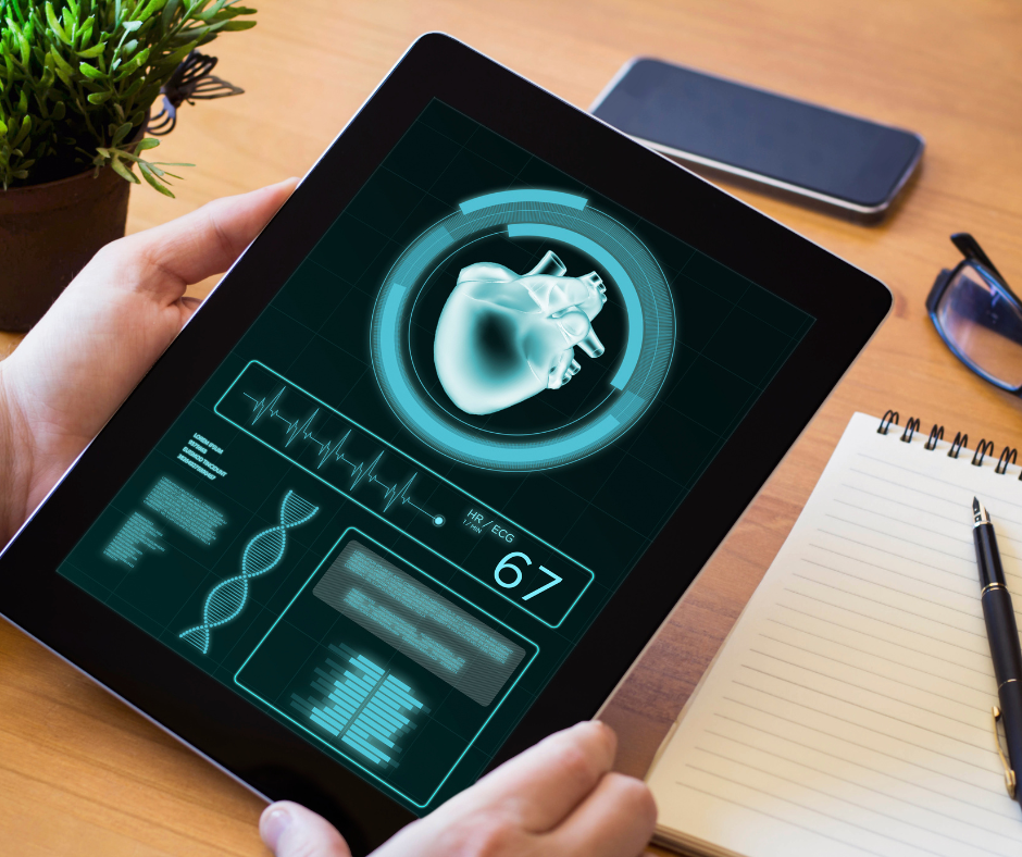 Tablet con visualización digital de un corazón y datos biométricos, representando el monitoreo de salud mediante inteligencia artificial.